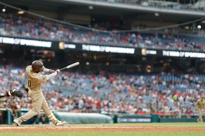 Jul 24, 2024; Washington, District of Columbia, USA; San Diego Padres outfielder Jurickson Profar (10) hits a two run home run against the Washington Nationals during the second inning at Nationals Park. Mandatory Credit: Geoff Burke-USA TODAY Sports