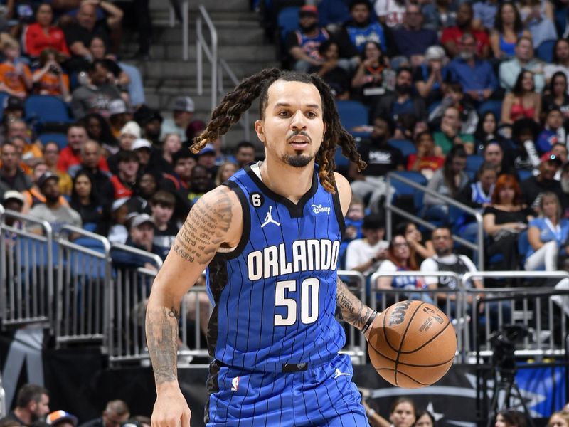 ORLANDO, FL - MARCH 23: Cole Anthony #50 of the Orlando Magic dribbles the ball during the game against the New York Knicks on March 23, 2023 at Amway Center in Orlando, Florida. NOTE TO USER: User expressly acknowledges and agrees that, by downloading and or using this photograph, User is consenting to the terms and conditions of the Getty Images License Agreement. Mandatory Copyright Notice: Copyright 2023 NBAE (Photo by Fernando Medina/NBAE via Getty Images)