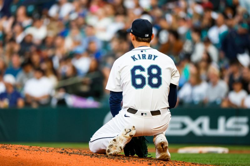 Jul 2, 2024; Seattle, Washington, USA; Seattle Mariners starting pitcher George Kirby (68) kneels on the mound after surrendering an RBI-single against the Baltimore Orioles during the seventh inning at T-Mobile Park. Mandatory Credit: Joe Nicholson-USA TODAY Sports