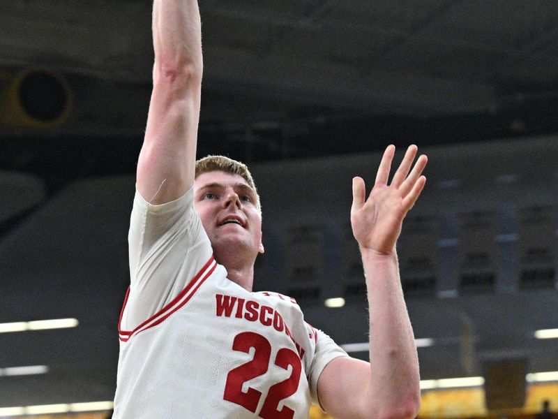 Feb 17, 2024; Iowa City, Iowa, USA; Wisconsin Badgers forward Steven Crowl (22) goes to the basket against the Iowa Hawkeyes during the first half at Carver-Hawkeye Arena. Mandatory Credit: Jeffrey Becker-USA TODAY Sports