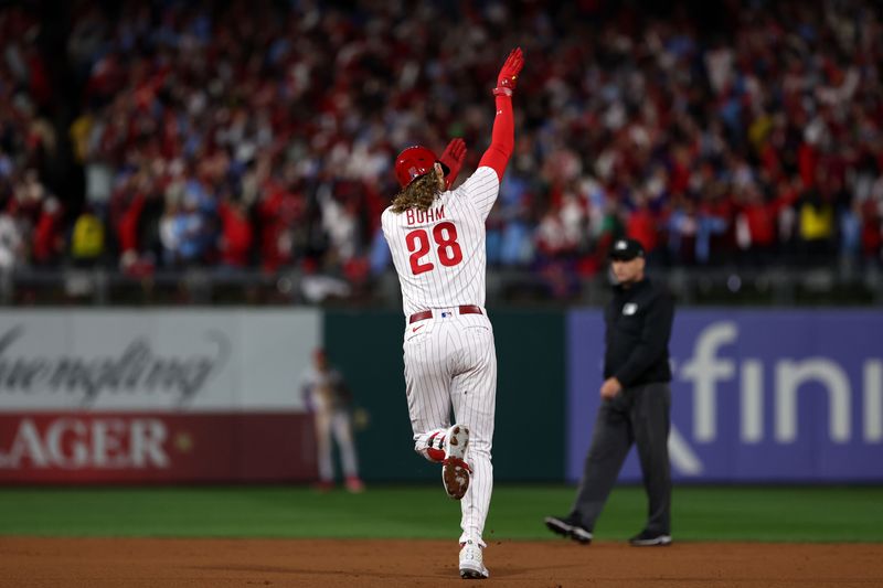 Oct 24, 2023; Philadelphia, Pennsylvania, USA; Philadelphia Phillies first baseman Alec Bohm (28) reacts after hitting a home run against the Arizona Diamondbacks in the second inning for game seven of the NLCS for the 2023 MLB playoffs at Citizens Bank Park. Mandatory Credit: Bill Streicher-USA TODAY Sports