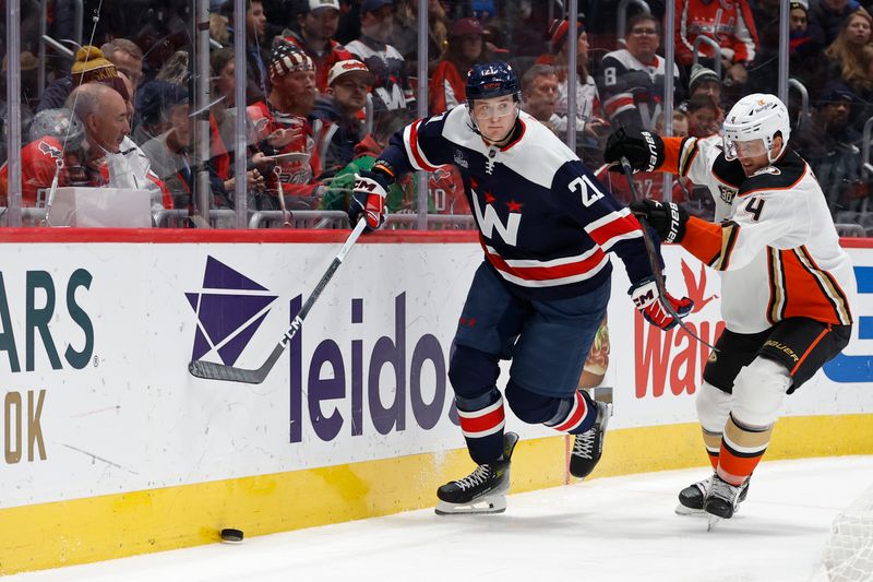 Jan 16, 2024; Washington, District of Columbia, USA; Washington Capitals center Aliaksei Protas (21) skates with the puck as Anaheim Ducks defenseman Cam Fowler (4) defends in the third period at Capital One Arena. Mandatory Credit: Geoff Burke-USA TODAY Sports