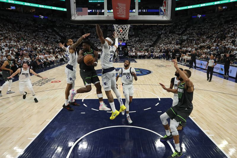 MINNEAPOLIS, MN - MAY 30: Anthony Edwards #5 of the Minnesota Timberwolves passes the ball during the game against the Dallas Mavericks during Game 5 of the Western Conference Finals of the 2024 NBA Playoffs on May 30, 2024 at Target Center in Minneapolis, Minnesota. NOTE TO USER: User expressly acknowledges and agrees that, by downloading and or using this Photograph, user is consenting to the terms and conditions of the Getty Images License Agreement. Mandatory Copyright Notice: Copyright 2024 NBAE (Photo by Jordan Johnson/NBAE via Getty Images)