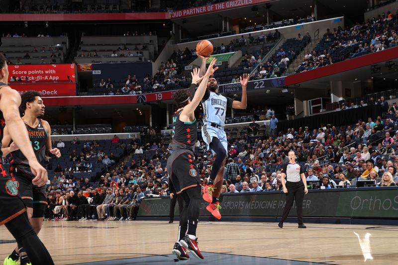 MEMPHIS, TN - MARCH 12: DeJon Jarreau #77 of the Memphis Grizzlies  shoots the ball during the game against the Washington Wizards on March 12, 2024 at FedExForum in Memphis, Tennessee. NOTE TO USER: User expressly acknowledges and agrees that, by downloading and or using this photograph, User is consenting to the terms and conditions of the Getty Images License Agreement. Mandatory Copyright Notice: Copyright 2024 NBAE (Photo by Joe Murphy/NBAE via Getty Images)