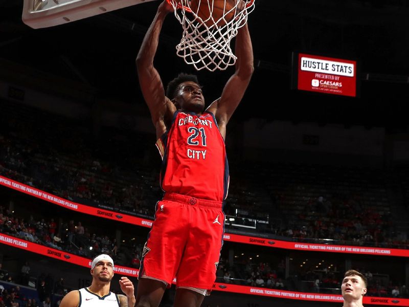 NEW ORLEANS, LA - NOVEMBER 15: Yves Missi #21 of the New Orleans Pelicans dunks the ball during the game against the Denver Nuggets during the Emirates NBA Cup game on November 15, 2024 at the Smoothie King Center in New Orleans, Louisiana. NOTE TO USER: User expressly acknowledges and agrees that, by downloading and or using this Photograph, user is consenting to the terms and conditions of the Getty Images License Agreement. Mandatory Copyright Notice: Copyright 2024 NBAE (Photo by Layne Murdoch Jr./NBAE via Getty Images)