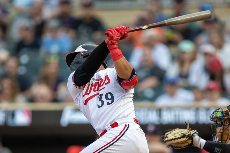 May 23, 2023; Minneapolis, Minnesota, USA; Minnesota Twins third baseman Donovan Solano (39) hits a single in the first inning against the San Francisco Giants at Target Field. Mandatory Credit: Jesse Johnson-USA TODAY Sports