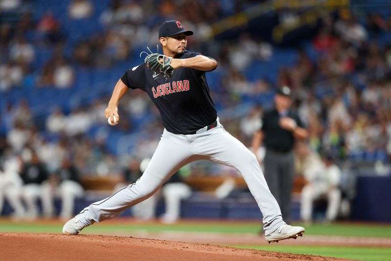 Jul 12, 2024; St. Petersburg, Florida, USA; Cleveland Guardians pitcher Carlos Carrasco (59) throws a pitch against the Tampa Bay Rays in the first inning at Tropicana Field. Mandatory Credit: Nathan Ray Seebeck-USA TODAY Sports