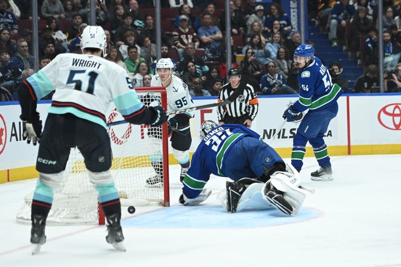 Apr 2, 2025; Vancouver, British Columbia, CAN;  Seattle Kraken forward Andre Burakovsky (95) scores against Vancouver Canucks goaltender Thatcher Demko (35) during the third period at Rogers Arena. Mandatory Credit: Simon Fearn-Imagn Images