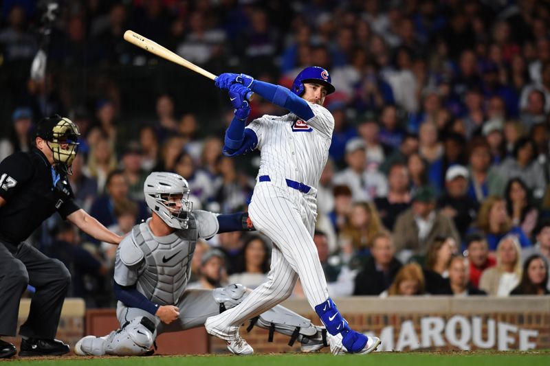 Aug 20, 2024; Chicago, Illinois, USA; Chicago Cubs right fielder Cody Bellinger (24) hits a two-run double during the fifth inning against the Detroit Tigers at Wrigley Field. Mandatory Credit: Patrick Gorski-USA TODAY Sports