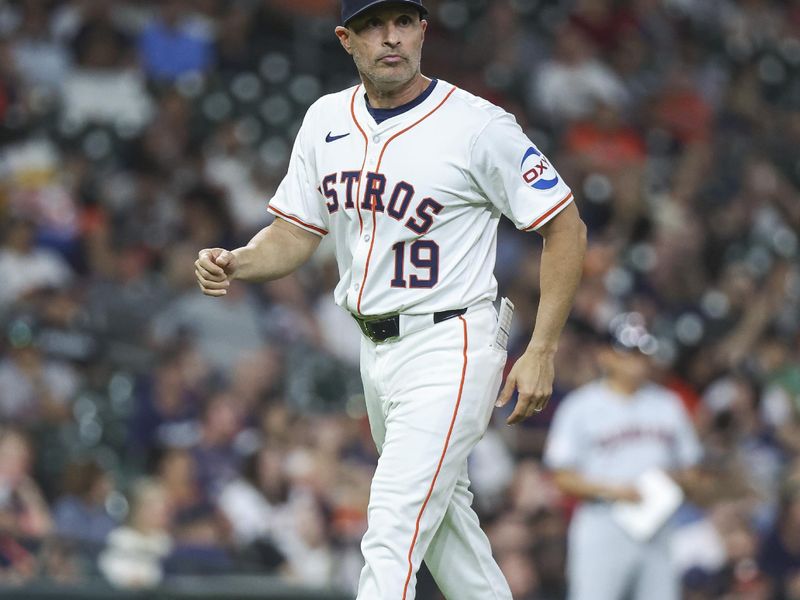 May 2, 2024; Houston, Texas, USA; Houston Astros manager Joe Espada (19) walks off the field after a pitching change during the sixth inning against the Cleveland Guardians at Minute Maid Park. Mandatory Credit: Troy Taormina-USA TODAY Sports