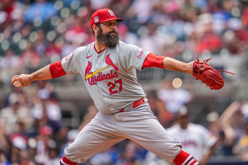 Jul 21, 2024; Cumberland, Georgia, USA; St. Louis Cardinals relief pitcher Andrew Kittredge (27) pitches against the Atlanta Braves during the eighth inning at Truist Park. Mandatory Credit: Dale Zanine-USA TODAY Sports