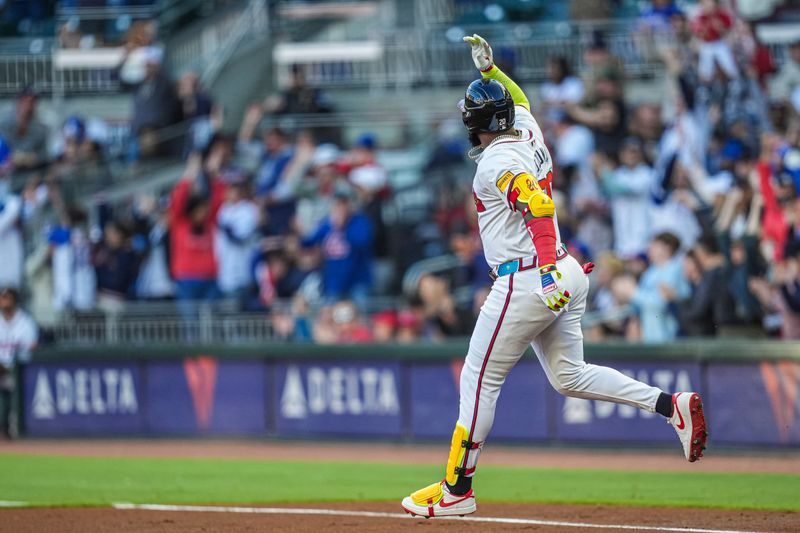 Apr 21, 2024; Cumberland, Georgia, USA; Atlanta Braves designated hitter Marcell Ozuna (20) reacts after hitting a three run home run against the Texas Rangers during the first inning at Truist Park. Mandatory Credit: Dale Zanine-USA TODAY Sports