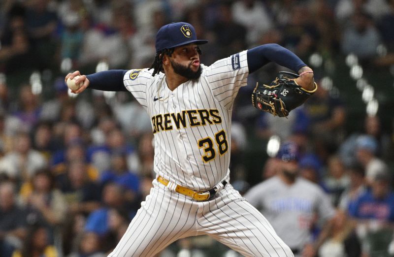 Sep 30, 2023; Milwaukee, Wisconsin, USA; Milwaukee Brewers relief pitcher Devin Williams (38) delivers a pitch against the Chicago Cubs in the eighth inning at American Family Field. Mandatory Credit: Michael McLoone-USA TODAY Sports