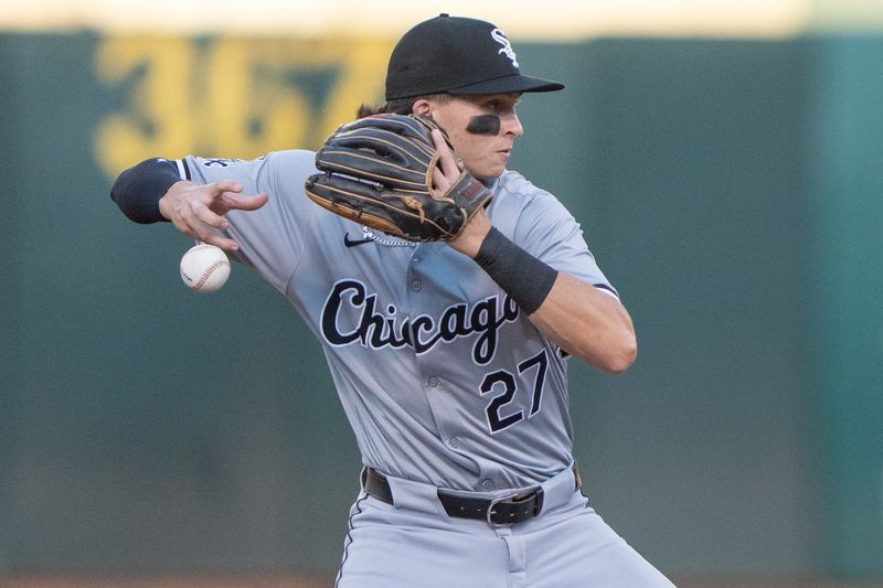 Aug 6, 2024; Oakland, California, USA;  Chicago White Sox shortstop Brooks Baldwin (27) mishandles the ball during the third inning against the Oakland Athletics at Oakland-Alameda County Coliseum. Mandatory Credit: Stan Szeto-USA TODAY Sports