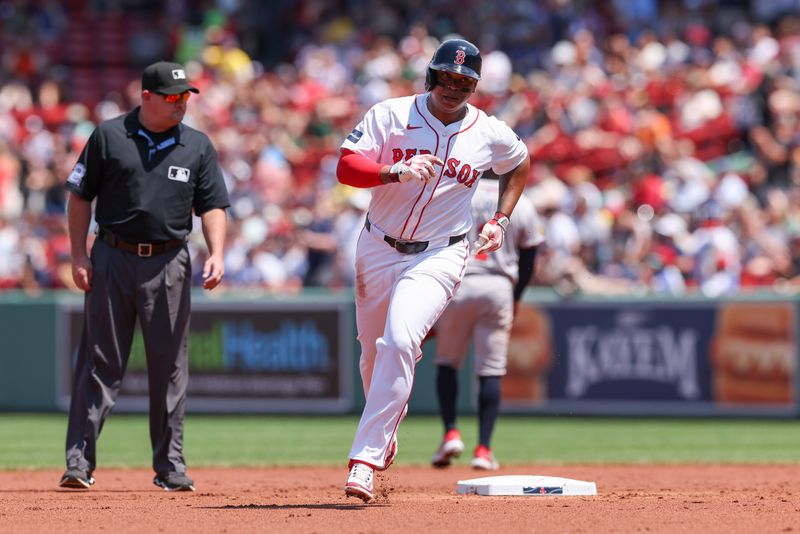 Jun 5, 2024; Boston, Massachusetts, USA; Boston Red Sox third baseman Rafael Devers (11) rounds the bases after hitting a solo home run during the second inning against the Atlanta Braves at Fenway Park. Mandatory Credit: Paul Rutherford-USA TODAY Sports