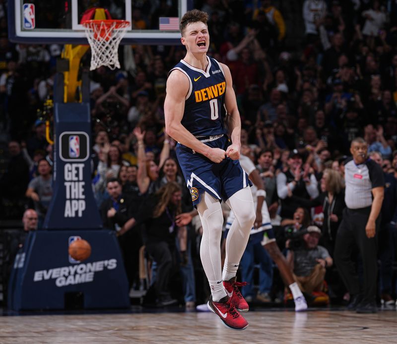 DENVER, CO - APRIL 10: Christian Braun #0 of the Denver Nuggets celebrates during the game against the Minnesota Timberwolves on April 10, 2024 at the Ball Arena in Denver, Colorado. NOTE TO USER: User expressly acknowledges and agrees that, by downloading and/or using this Photograph, user is consenting to the terms and conditions of the Getty Images License Agreement. Mandatory Copyright Notice: Copyright 2024 NBAE (Photo by Bart Young/NBAE via Getty Images)