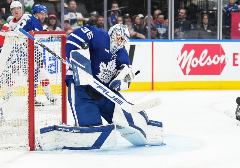 Apr 13, 2024; Toronto, Ontario, CAN; Toronto Maple Leafs goaltender Ilya Samsonov (35) stops a puck against the Detroit Red Wings during the second period at Scotiabank Arena. Mandatory Credit: Nick Turchiaro-USA TODAY Sports