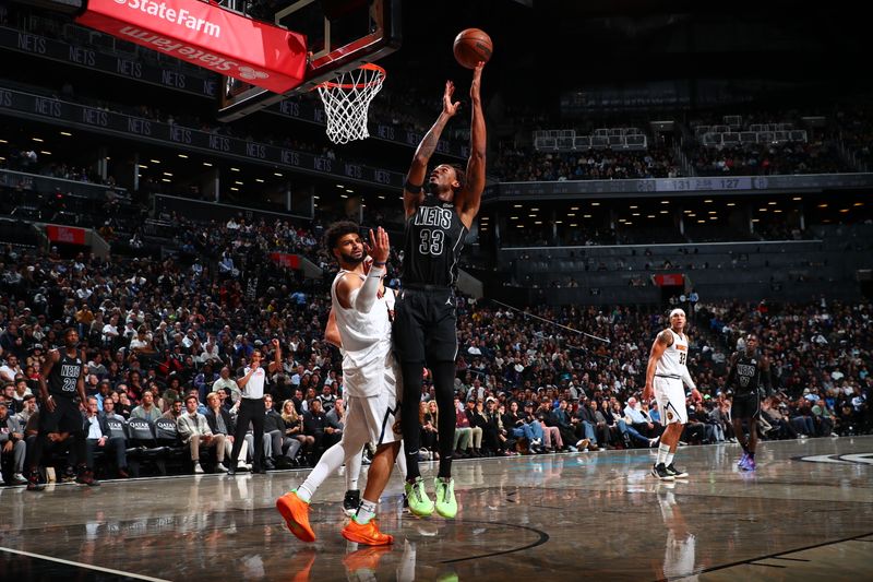 BROOKLYN, NY - OCTOBER 29: Nicolas Claxton #33 of the Brooklyn Nets shoots the ball during the game against the Denver Nuggets on October 29, 2024 at Barclays Center in Brooklyn, New York. NOTE TO USER: User expressly acknowledges and agrees that, by downloading and or using this Photograph, user is consenting to the terms and conditions of the Getty Images License Agreement. Mandatory Copyright Notice: Copyright 2024 NBAE (Photo by David L. Nemec/NBAE via Getty Images)