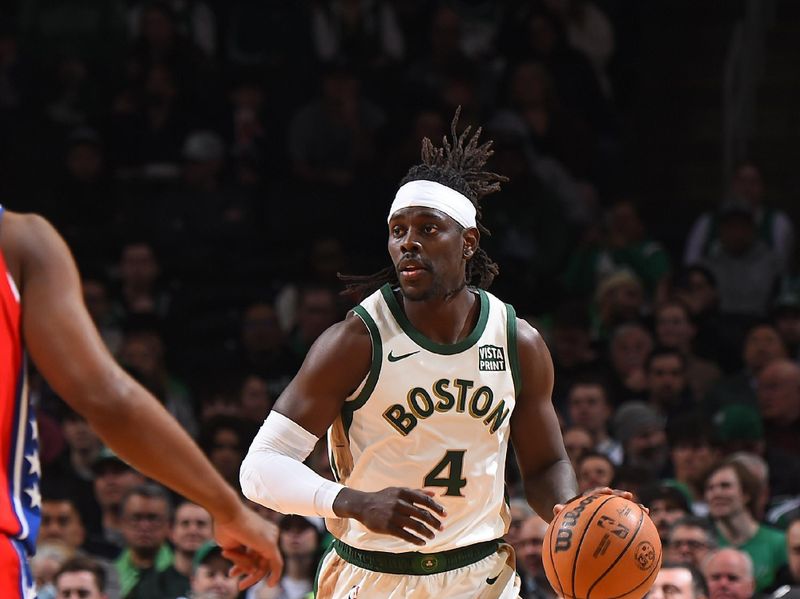 BOSTON, MA - FEBRUARY 27: Jrue Holiday #4 of the Boston Celtics brings the ball up court during the game against the Philadelphia 76ers on February 27, 2024 at the TD Garden in Boston, Massachusetts. NOTE TO USER: User expressly acknowledges and agrees that, by downloading and or using this photograph, User is consenting to the terms and conditions of the Getty Images License Agreement. Mandatory Copyright Notice: Copyright 2024 NBAE  (Photo by Brian Babineau/NBAE via Getty Images)