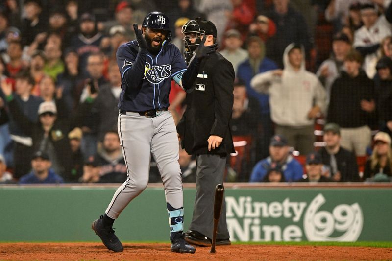 Jun 9, 2025; Boston, Massachusetts, USA; Tampa Bay Rays third baseman Junior Caminero (13) reacts after being walked allowing for a run to score against the Boston Red Sox during the eleventh inning at Fenway Park. Mandatory Credit: Brian Fluharty-Imagn Images