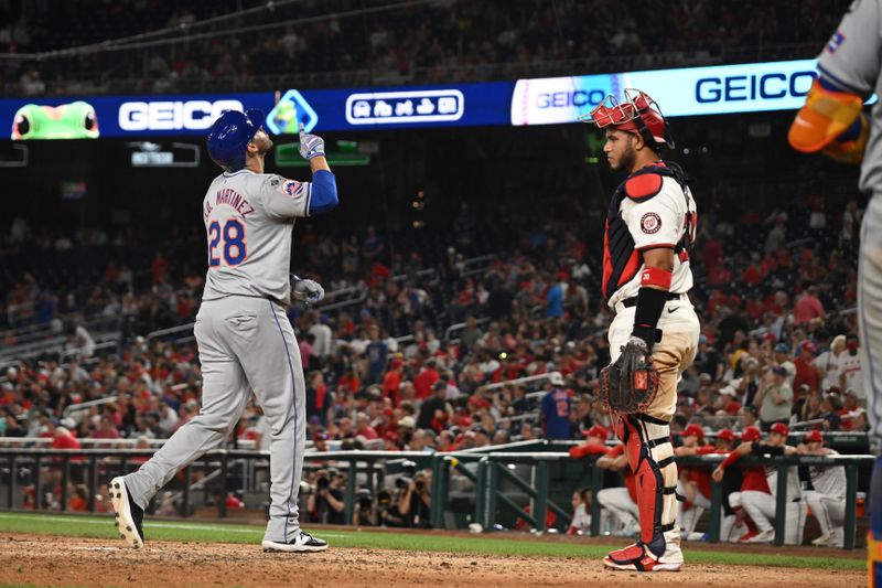 Jul 1, 2024; Washington, District of Columbia, USA; New York Mets designated hitter J.D. Martinez (28) looks to the sky in front of Washington Nationals catcher Keibert Ruiz (20) after hitting a three run home run during the tenth inning at Nationals Park. Mandatory Credit: Rafael Suanes-USA TODAY Sports