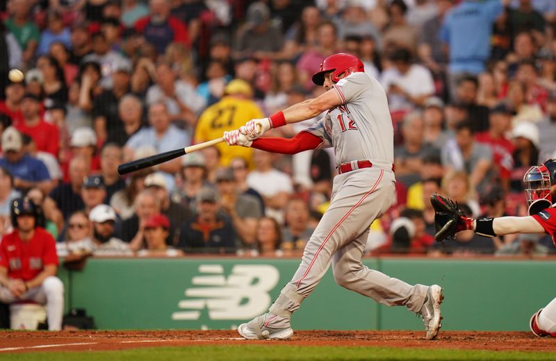 Jun 1, 2023; Boston, Massachusetts, USA; Cincinnati Reds catcher Curt Casali (12) hits a double against the Boston Red Sox in the third inning at Fenway Park. Mandatory Credit: David Butler II-USA TODAY Sports