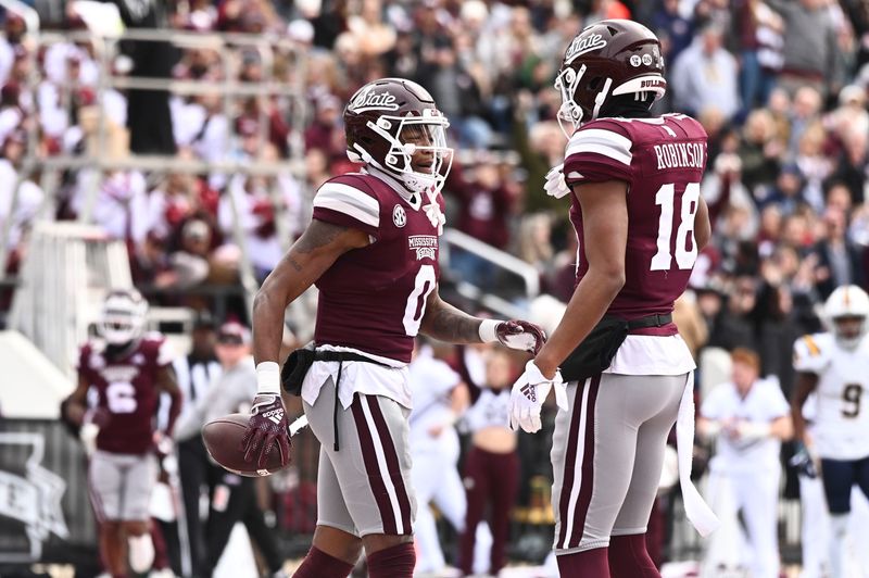 Nov 19, 2022; Starkville, Mississippi, USA; Mississippi State Bulldogs wide receiver Rara Thomas (0) reacts with wide receiver Justin Robinson (18) after a touchdown against the East Tennessee State Buccaneers during the first quarter at Davis Wade Stadium at Scott Field. Mandatory Credit: Matt Bush-USA TODAY Sports