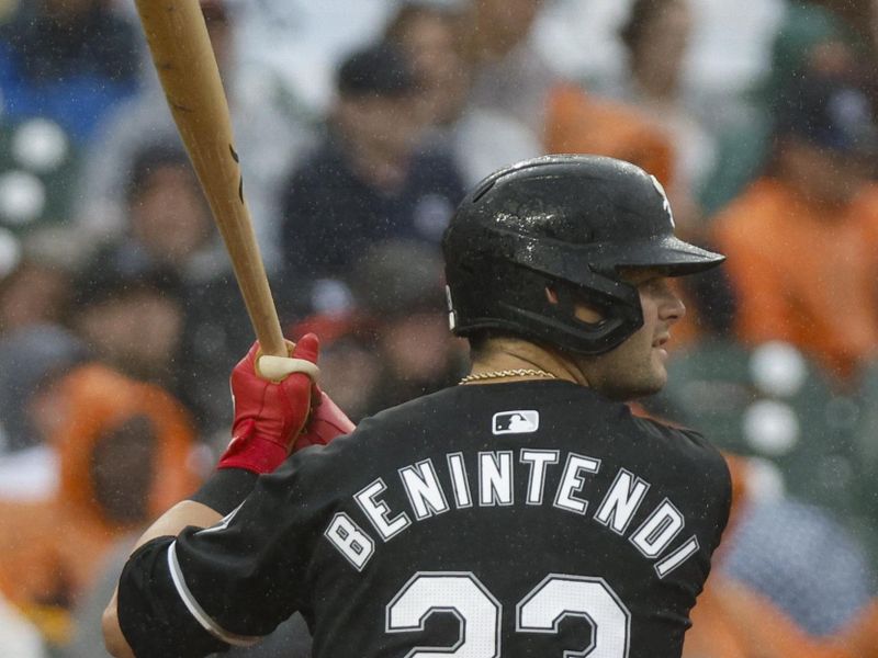 Sep 28, 2024; Detroit, Michigan, USA; Chicago White Sox outfielder Andrew Benintendi (23) hits during the third inning against the Detroit Tigers at Comerica Park. Mandatory Credit: Brian Bradshaw Sevald-Imagn Images