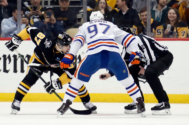 Feb 23, 2023; Pittsburgh, Pennsylvania, USA; Pittsburgh Penguins center Sidney Crosby (87) and Edmonton Oilers center Connor McDavid (97) take a face-off during the first period at PPG Paints Arena. Mandatory Credit: Charles LeClaire-USA TODAY Sports