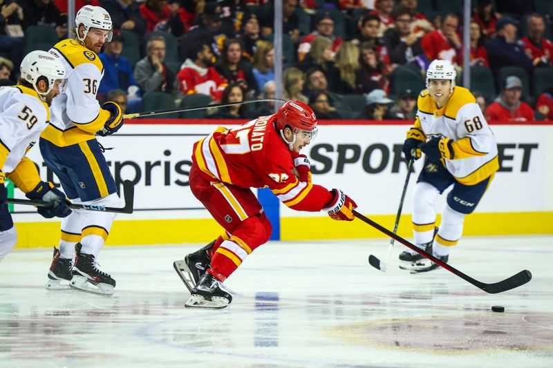 Nov 15, 2024; Calgary, Alberta, CAN; Calgary Flames right wing Matt Coronato (27) skates with the puck against the Nashville Predators during the third period at Scotiabank Saddledome. Mandatory Credit: Sergei Belski-Imagn Images