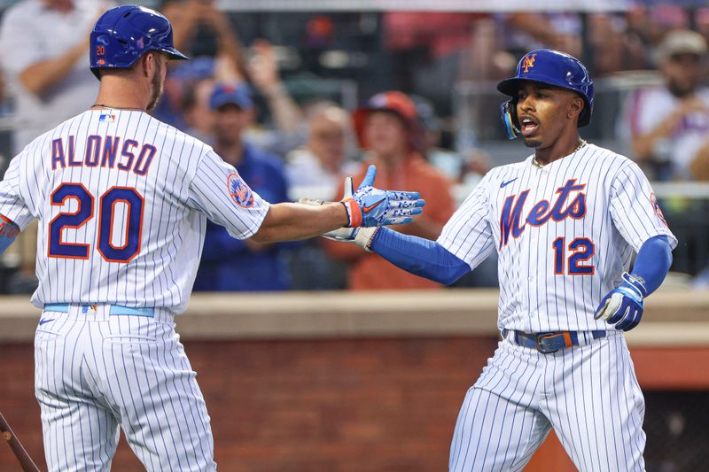 Jun 27, 2023; New York City, New York, USA; New York Mets shortstop Francisco Lindor (12) celebrates with first baseman Pete Alonso (20) after his solo home run during the fourth inning against the Milwaukee Brewers at Citi Field. Mandatory Credit: Vincent Carchietta-USA TODAY Sports