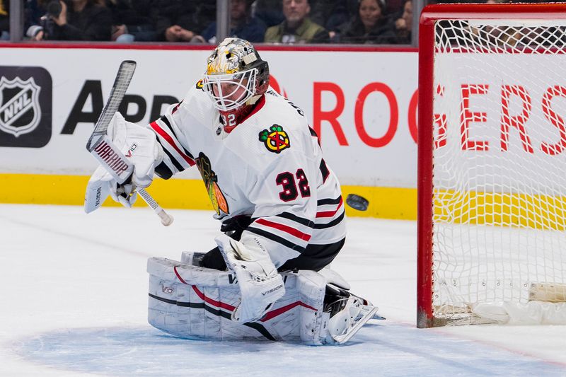 Apr 6, 2023; Vancouver, British Columbia, CAN; Chicago Blackhawks goalie Alex Stalock (32) makes a save against the Vancouver Canucks in the first period at Rogers Arena. Mandatory Credit: Bob Frid-USA TODAY Sports