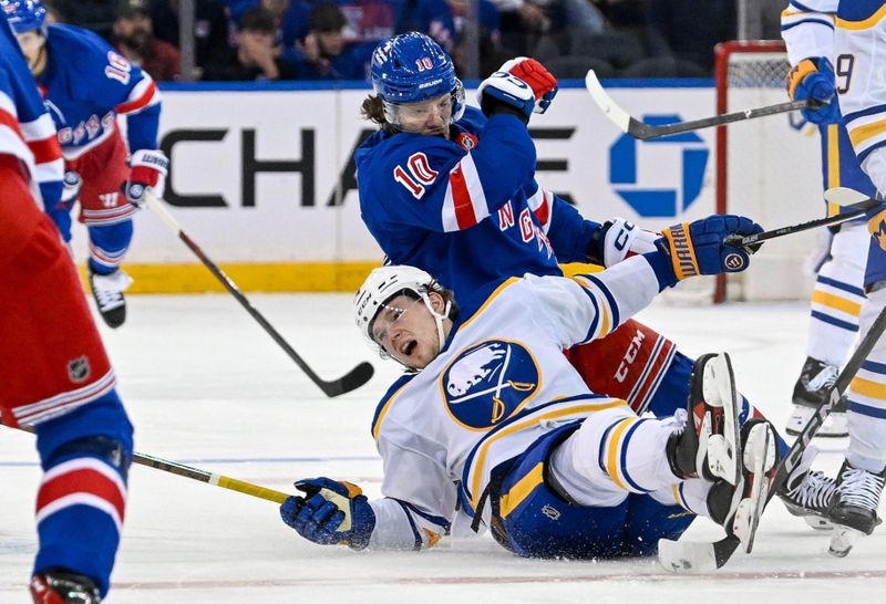 Nov 7, 2024; New York, New York, USA;  Buffalo Sabres defenseman Bowen Byram (4) and New York Rangers left wing Artemi Panarin (10) collide during the third period at Madison Square Garden. Mandatory Credit: Dennis Schneidler-Imagn Images