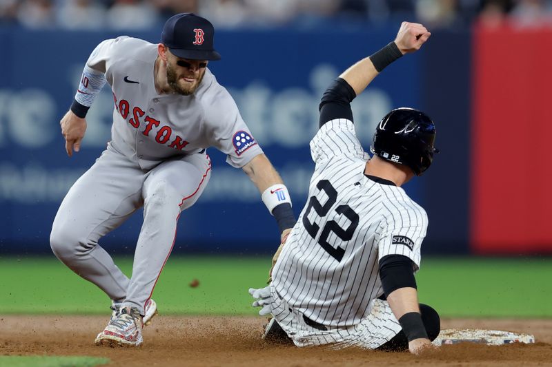 Jun 7, 2025; Bronx, New York, USA; Boston Red Sox shortstop Trevor Story (10) tags out New York Yankees designated hitter Ben Rice (22) at second to complete a double play on a ball hit by Yankees center fielder Cody Bellinger (not pictured) during the fifth inning at Yankee Stadium. Mandatory Credit: Brad Penner-Imagn Images