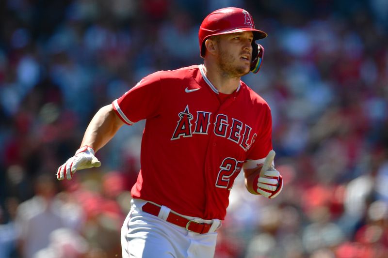 Jun 29, 2023; Anaheim, California, USA; Los Angeles Angels center fielder Mike Trout (27) runs after hitting a single against the Chicago White Sox during the seventh inning at Angel Stadium. Mandatory Credit: Gary A. Vasquez-USA TODAY Sports