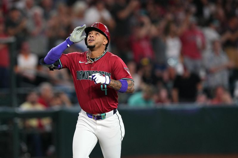 May 5, 2024; Phoenix, Arizona, USA; Arizona Diamondbacks second base Ketel Marte (4) runs the bases after hitting a two run home run against the San Diego Padres during the first inning at Chase Field. Mandatory Credit: Joe Camporeale-USA TODAY Sports