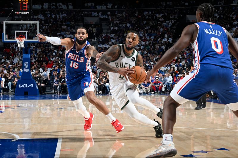 PHILADELPHIA, PA - OCTOBER 23: Damian Lillard #0 of the Milwaukee Bucks drives to the basket during the game against the Philadelphia 76ers on October 23, 2024 at the Wells Fargo Center in Philadelphia, Pennsylvania NOTE TO USER: User expressly acknowledges and agrees that, by downloading and/or using this Photograph, user is consenting to the terms and conditions of the Getty Images License Agreement. Mandatory Copyright Notice: Copyright 2024 NBAE (Photo by David Dow/NBAE via Getty Images)