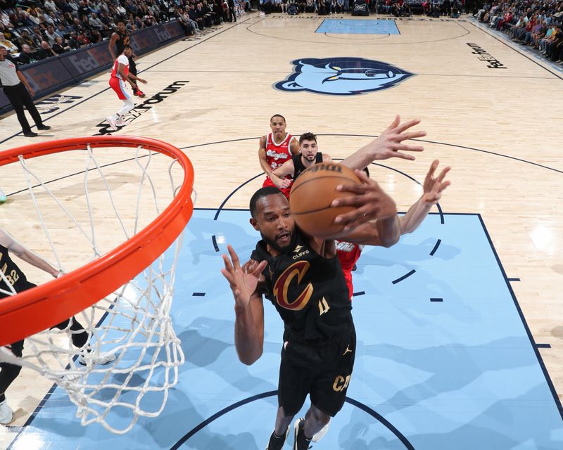 MEMPHIS, TN - MARCH 14: Evan Mobley #4 of the Cleveland Cavaliers rebounds during the game against the Memphis Grizzlies on March 14, 2025 at FedExForum in Memphis, Tennessee. NOTE TO USER: User expressly acknowledges and agrees that, by downloading and or using this photograph, User is consenting to the terms and conditions of the Getty Images License Agreement. Mandatory Copyright Notice: Copyright 2025 NBAE(Photo by Joe Murphy/NBAE via Getty Images)