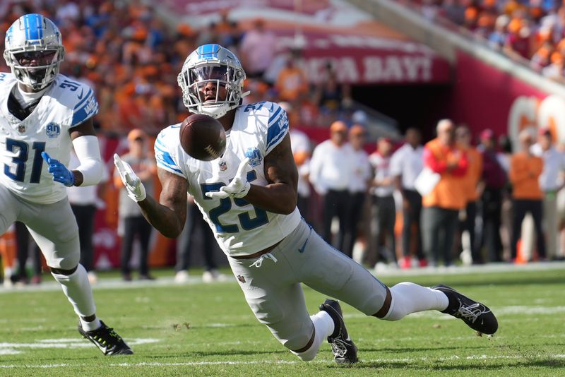 Detroit Lions cornerback Will Harris (25) intercepts a tipped pass in the first half during an NFL football game against the Tampa Bay Buccaneers, Sunday, Oct. 15 2023, in Tampa, Fla. (AP Photo/Peter Joneleit)