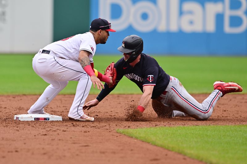 Sep 6, 2023; Cleveland, Ohio, USA; Minnesota Twins catcher Ryan Jeffers (27) is caught stealing by Cleveland Guardians shortstop Gabriel Arias (13) during the seventh inning at Progressive Field. Mandatory Credit: Ken Blaze-USA TODAY Sports