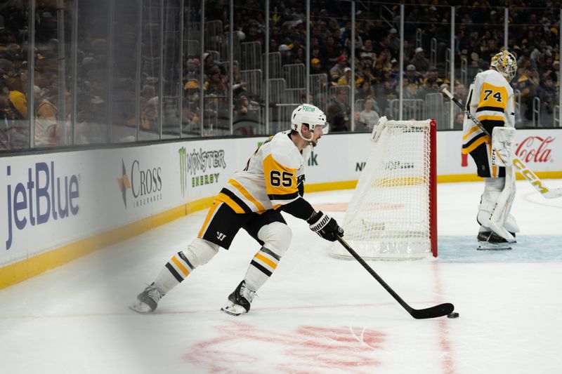 Jan 11, 2026; Boston, Massachusetts, USA; Pittsburgh Penguins defenseman Erik Karlsson (65) skates with the puck during the first period of the game against the Boston Bruins at TD Garden. Mandatory Credit: Natalie Reid-Imagn Images