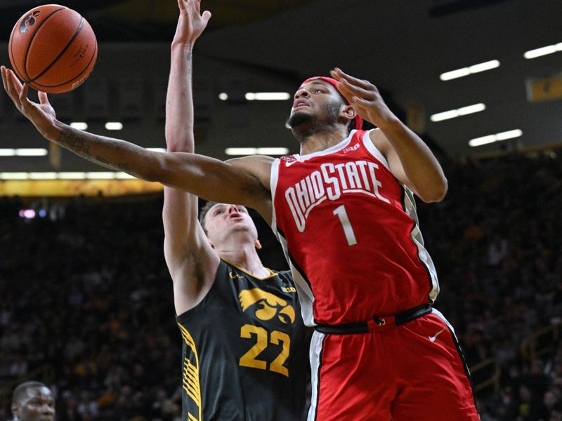 Feb 2, 2024; Iowa City, Iowa, USA; Ohio State Buckeyes guard Roddy Gayle Jr. (1) goes to the basket as Iowa Hawkeyes forward Patrick McCaffery (22) defends during the first half at Carver-Hawkeye Arena. Mandatory Credit: Jeffrey Becker-USA TODAY Sports