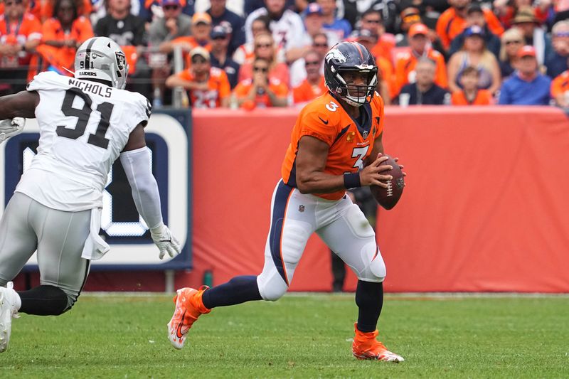 Denver Broncos quarterback Russell Wilson (3) plays against the Las Vegas Raiders of an NFL football game Sunday August 10, 2023, in Denver. (AP Photo/Bart Young)