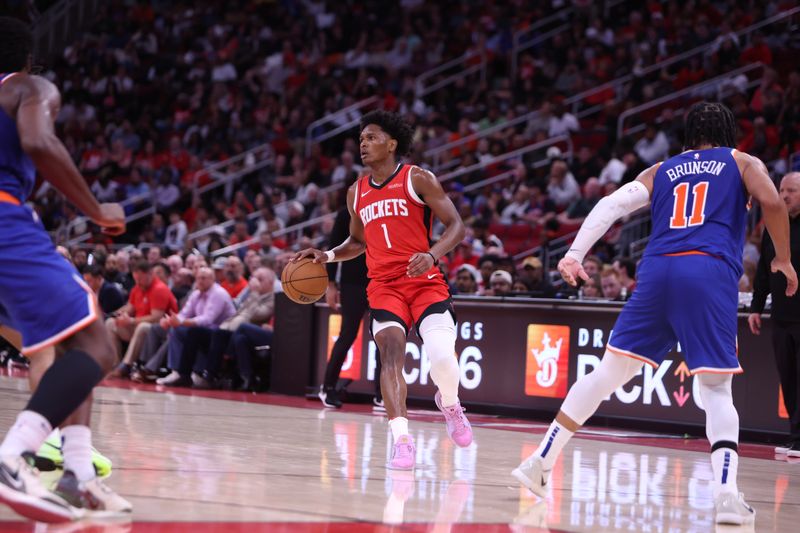 HOUSTON, TX - NOVEMBER 4: Amen Thompson #1 of the Houston Rockets handles the ball during the game against the New York Knicks on November 4, 2024 at the Toyota Center in Houston, Texas. NOTE TO USER: User expressly acknowledges and agrees that, by downloading and or using this photograph, User is consenting to the terms and conditions of the Getty Images License Agreement. Mandatory Copyright Notice: Copyright 2024 NBAE (Photo by Michael Starghill Jr./NBAE via Getty Images)