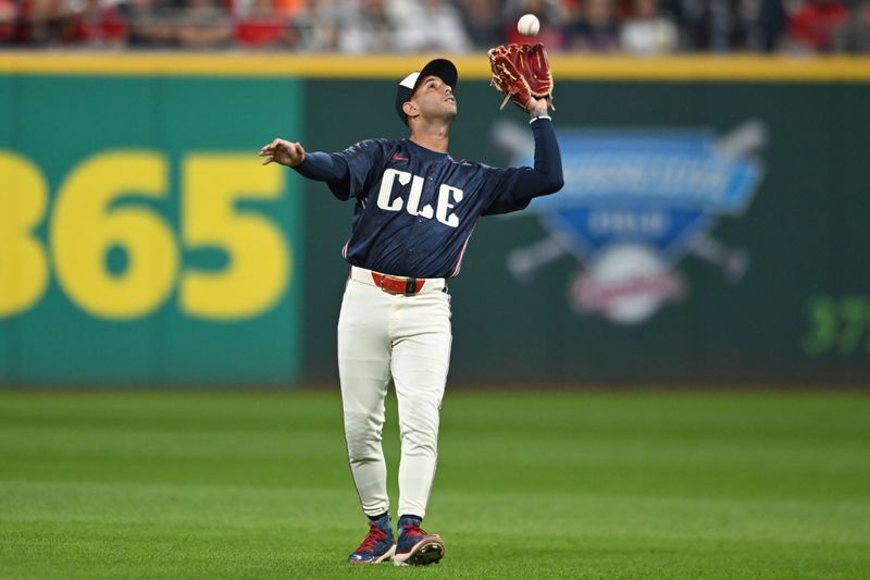 Sep 26, 2025; Cleveland, Ohio, USA; Cleveland Guardians second baseman Brayan Rocchio (4) catches a ball hit by  Texas Rangers shortstop Ezequiel Duran (not pictured) during the third inning at Progressive Field. Mandatory Credit: Ken Blaze-Imagn Images