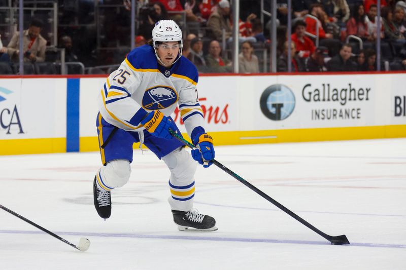 Nov 2, 2024; Detroit, Michigan, USA; Buffalo Sabres defenseman Owen Power (25) handles the puck during the first period of the game against the Detroit Red Wings at Little Caesars Arena. Mandatory Credit: Brian Bradshaw Sevald-Imagn Images