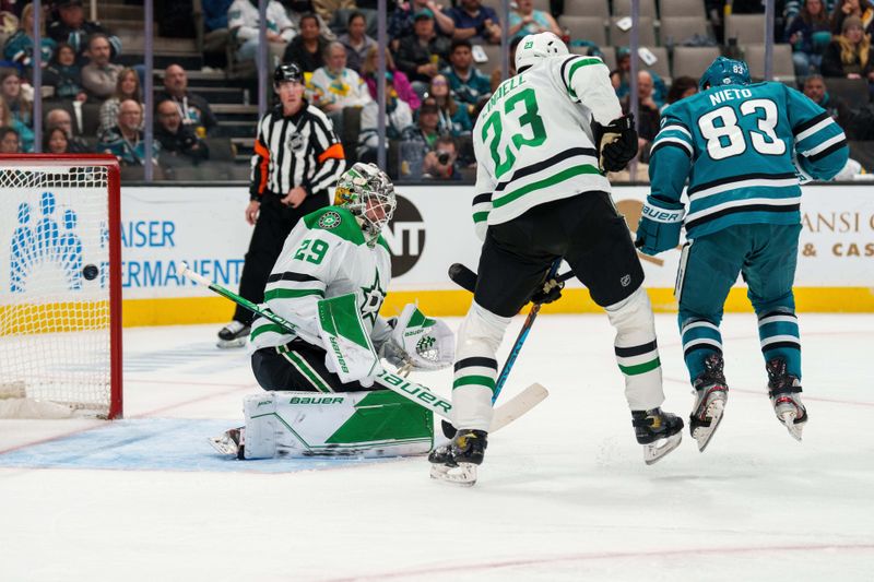 Jan 18, 2023; San Jose, California, USA; Dallas Stars goaltender Jake Oettinger (29) cannot stop the shot on goal during the second period as San Jose Sharks left wing Matt Nieto (83) blocks his vision at SAP Center at San Jose. Mandatory Credit: Neville E. Guard-USA TODAY Sports