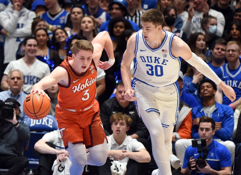 Feb 25, 2023; Durham, North Carolina, USA;  Virginia Tech Hokies guard Sean Pedulla (3) dribbles up court as Duke Blue Devils center Kyle Filipowski (30) defends during the first half at Cameron Indoor Stadium. Mandatory Credit: Rob Kinnan-USA TODAY Sports