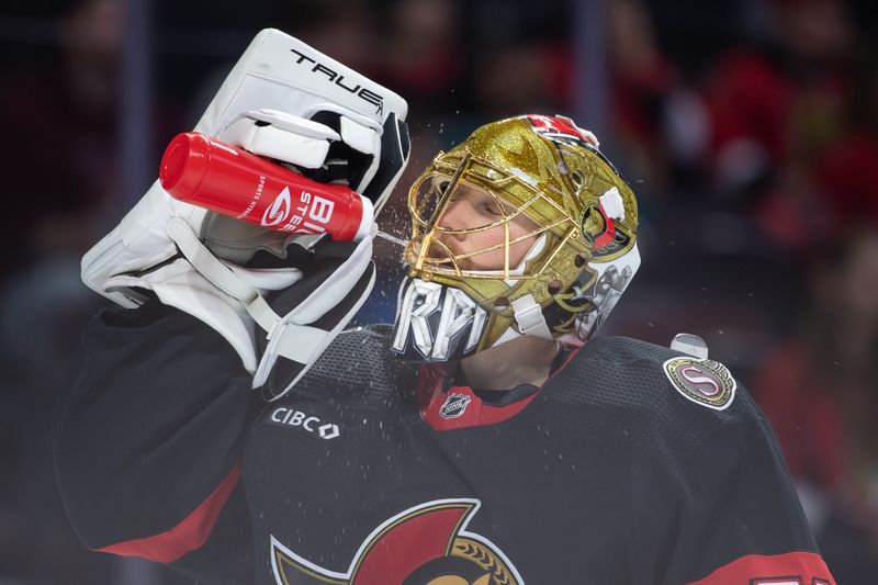 Jan 13, 2024; Ottawa, Ontario, CAN; Ottawa Senators goalie Joonas Korpisalo (70) hydrates prior to the start of the second period against the San Jose Sharks at the Canadian Tire Centre. Mandatory Credit: Marc DesRosiers-USA TODAY Sports