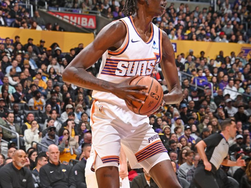 LOS ANGELES, CA - JANUARY 11: Bol Bol #11 of the Phoenix Suns looks to pass the ball during the game against the Los Angeles Lakers on January 11, 2024 at Crypto.Com Arena in Los Angeles, California. NOTE TO USER: User expressly acknowledges and agrees that, by downloading and/or using this Photograph, user is consenting to the terms and conditions of the Getty Images License Agreement. Mandatory Copyright Notice: Copyright 2024 NBAE (Photo by Andrew D. Bernstein/NBAE via Getty Images)